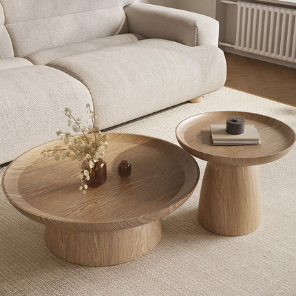 Kotto solid wood round coffee table with tray top pedestal base Japandi Scandinavian design for lounge space and calm interiors